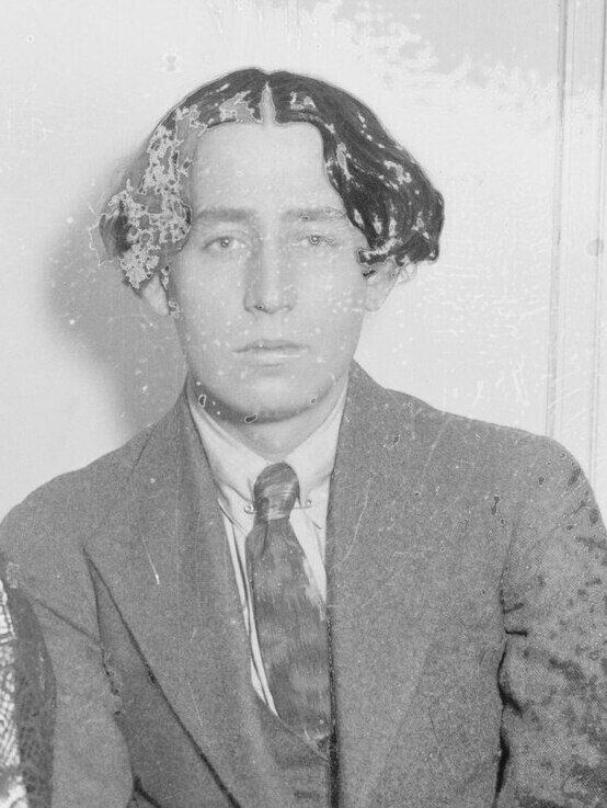 A black-and-white press portrait of a young man photographed in the second decade of the twentieth century.