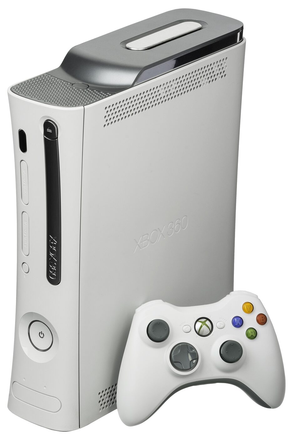 A white Xbox 360 console standing vertically against a plain white background, with a silver-grey hard-drive unit clipped along its upper side, and a white wireless controller with coloured face buttons propped in front of it.