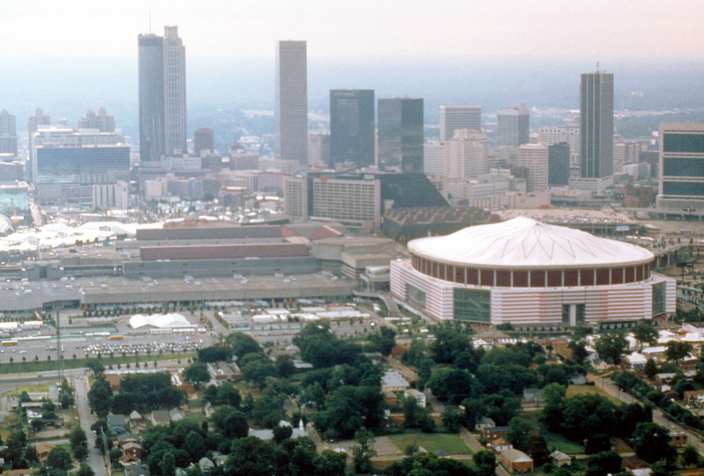 Aerial photograph of the Atlanta skyline with a stadium and sports complex in the foreground