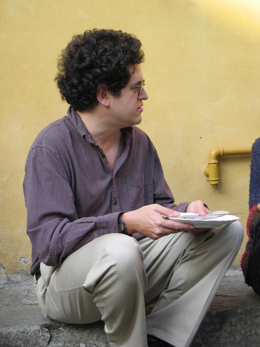 A photographic portrait of the mathematical physicist John Baez, in a dark shirt, looking towards the camera.