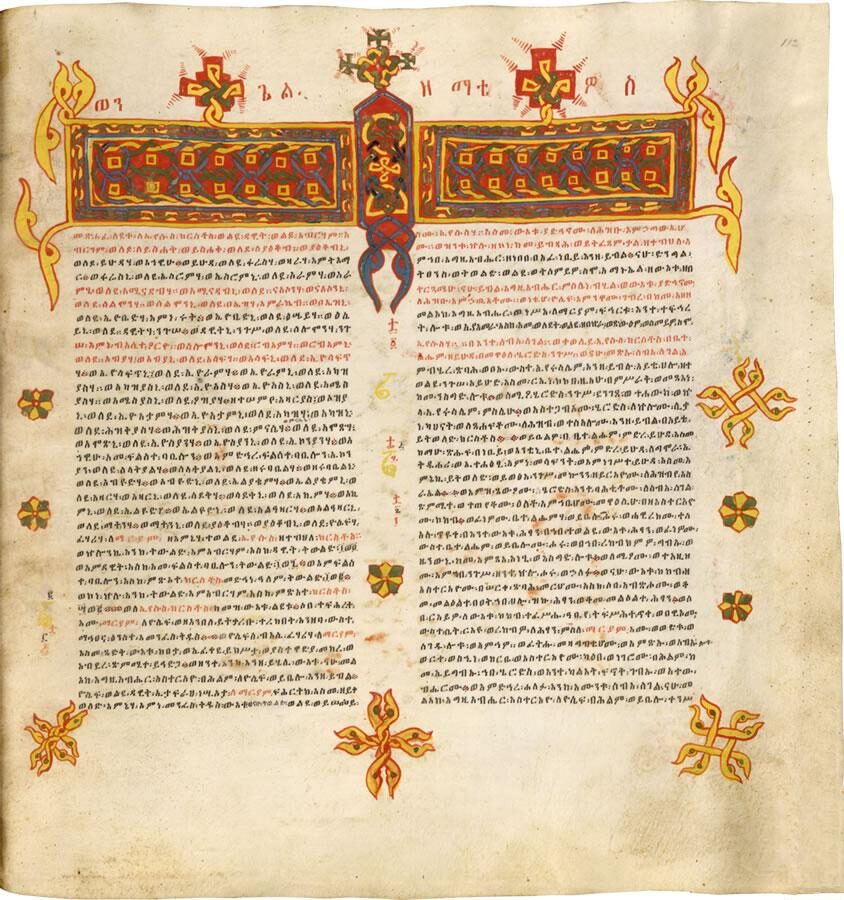 A manuscript page written in columns of Ethiopic syllabic characters in black and red ink.