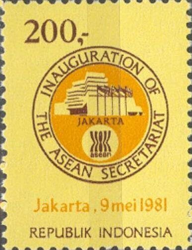 Yellow Indonesian postage stamp of 200 rupiah bearing a circular device reading Inauguration of the ASEAN Secretariat, with a drawing of the Jakarta building above the ASEAN sheaf emblem, and the line Jakarta, 9 mei 1981 beneath.