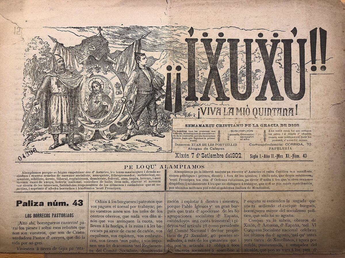 Front page of an old newspaper, browned with age. A wood engraving at top left shows a crusader and an Asturian countryman flanking an oval medallion of the Sacred Heart; beside it the masthead reads in heavy capitals with double exclamation marks. A dateline runs across the page above four columns of small type.