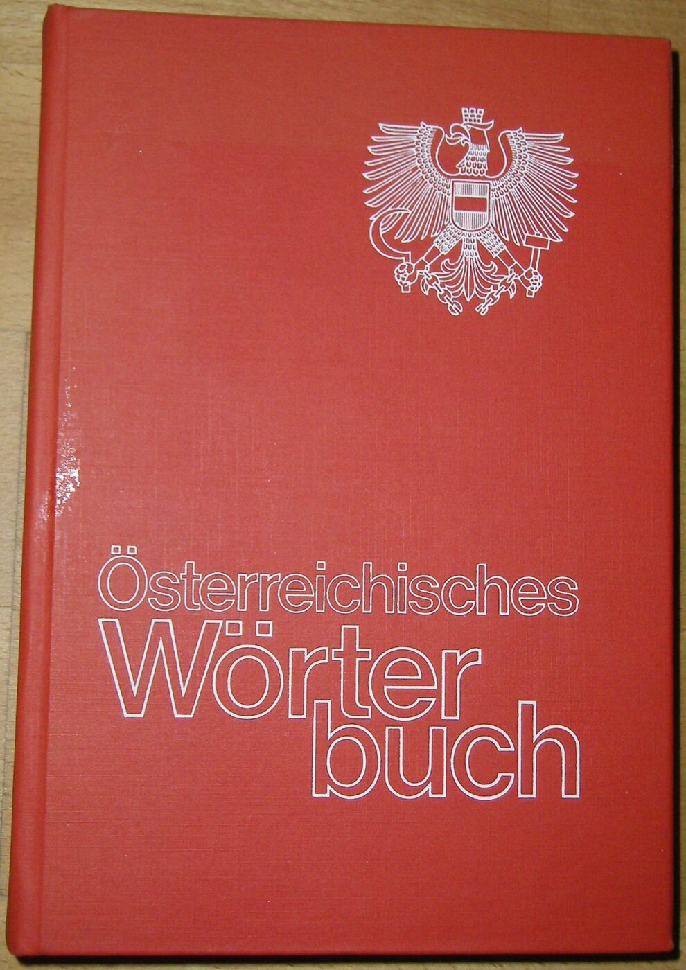 A red cloth book cover bearing the Austrian federal eagle in white line-work at the top and the title Österreichisches Wörterbuch below in large white outline lettering.