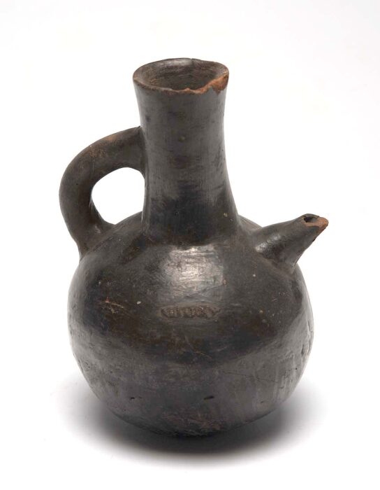 A rounded earthenware coffee pot with a long narrow neck, short spout and a small handle, photographed against a plain background.