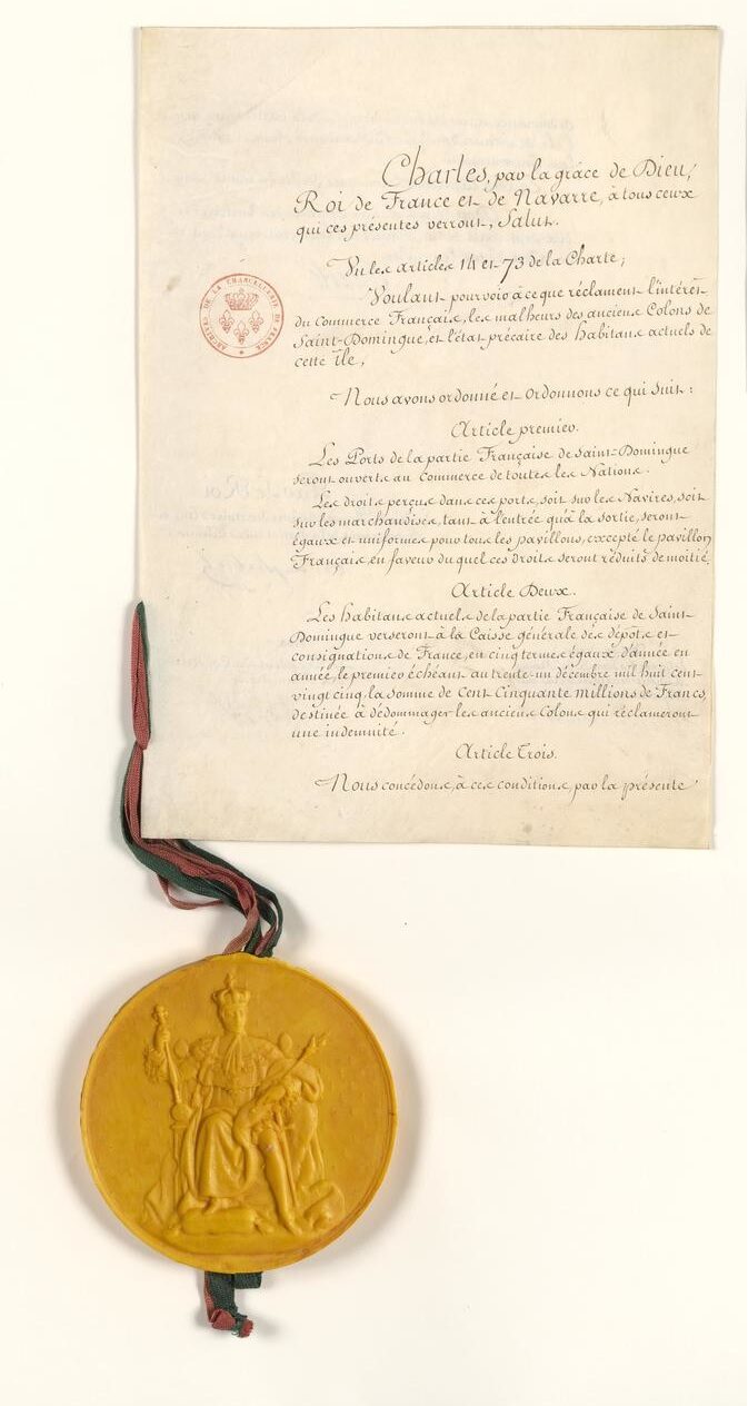 A manuscript page in looping French chancery hand, opening Charles, par la grace de Dieu, Roi de France et de Navarre, with an archival stamp at the upper left and a large yellow wax great seal hanging below on a green and red ribbon.