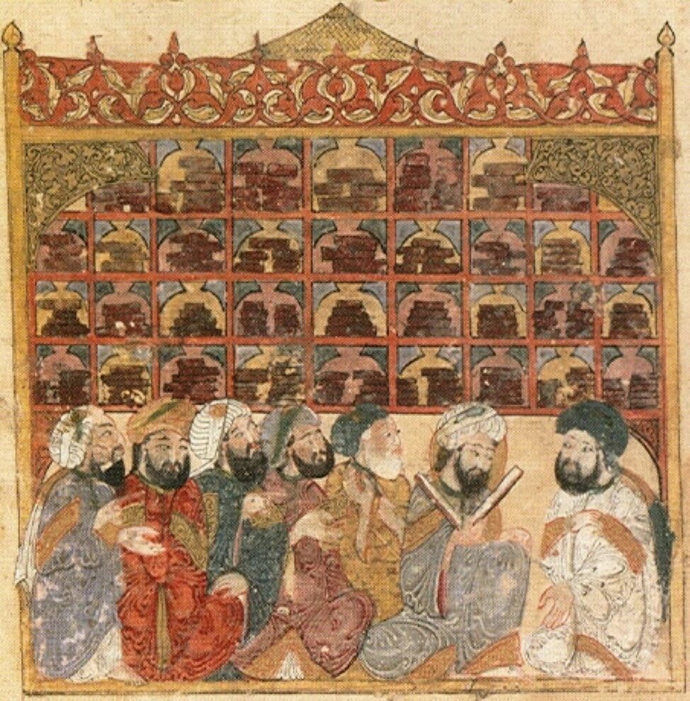 A medieval Arabic manuscript painting showing seated figures in robes and turbans among shelves of bound books, drawn in flat colour beneath decorative arches.