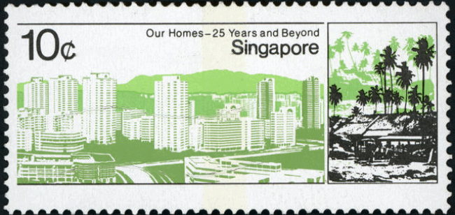Singapore postage stamp showing an attap house on the right and Housing and Development Board blocks on the left.
