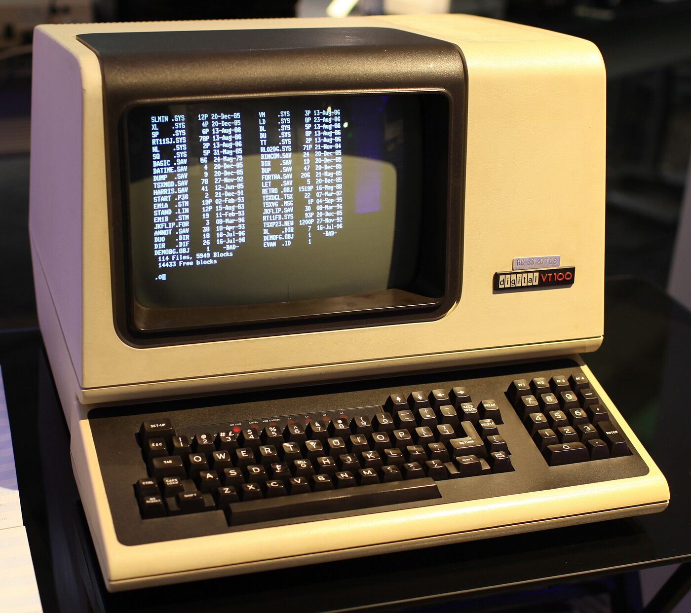 A beige DEC VT100 computer terminal with a monochrome screen and detached keyboard.